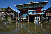 Inle Lake Myanmar. All the buildings are constructed on piles. Residents travel around by canoe, but there are also bamboo walkways and bridges over the canals, monasteries and stupas. 